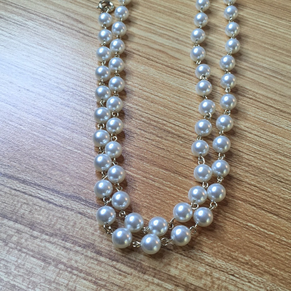 Single long pearl necklace